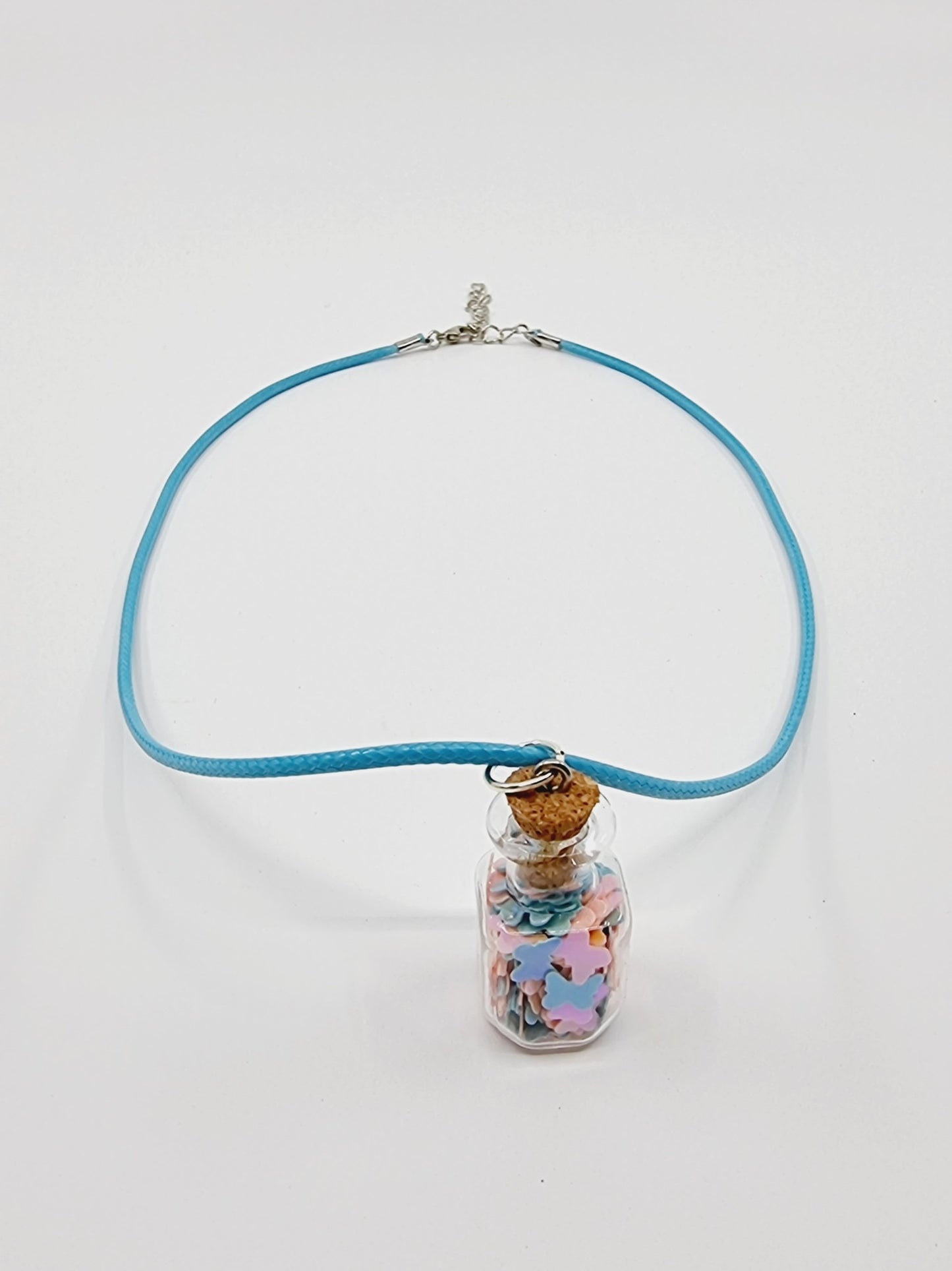 Collier fiole - étoiles roses/bleues pâles