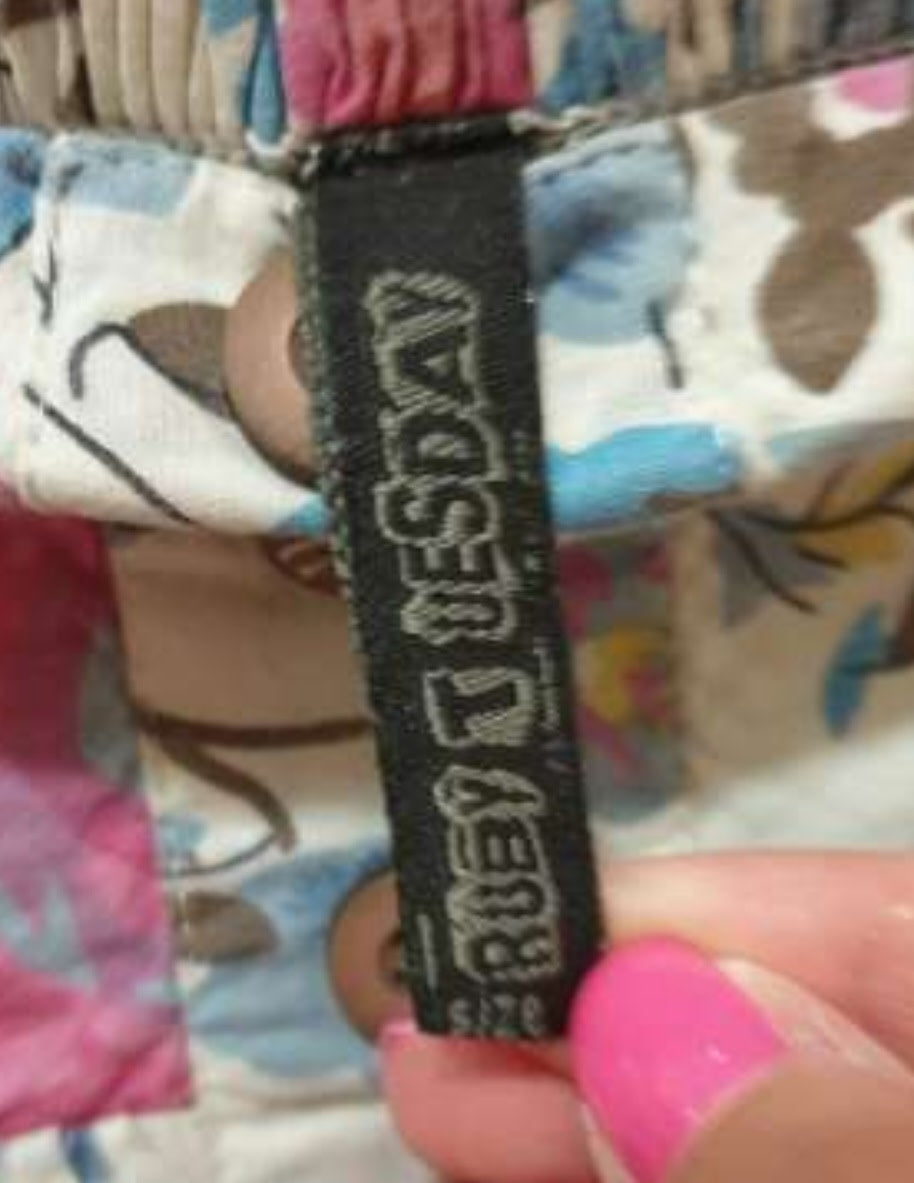 Jupe fleurie avec boutons apparents (SIZE : XS)