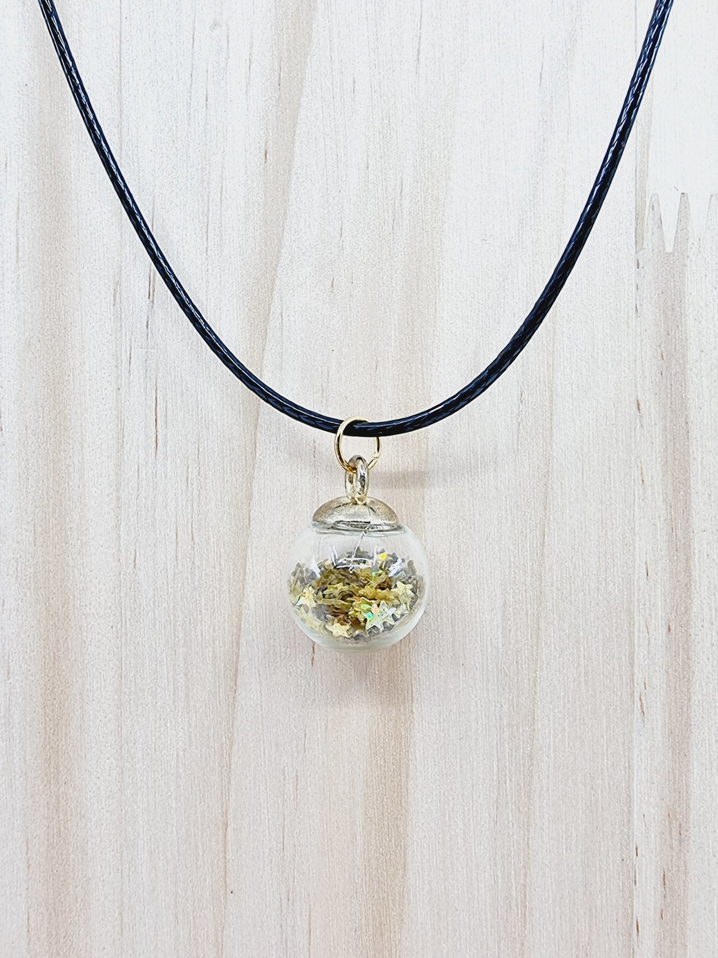 Collier boule - étoiles dorées