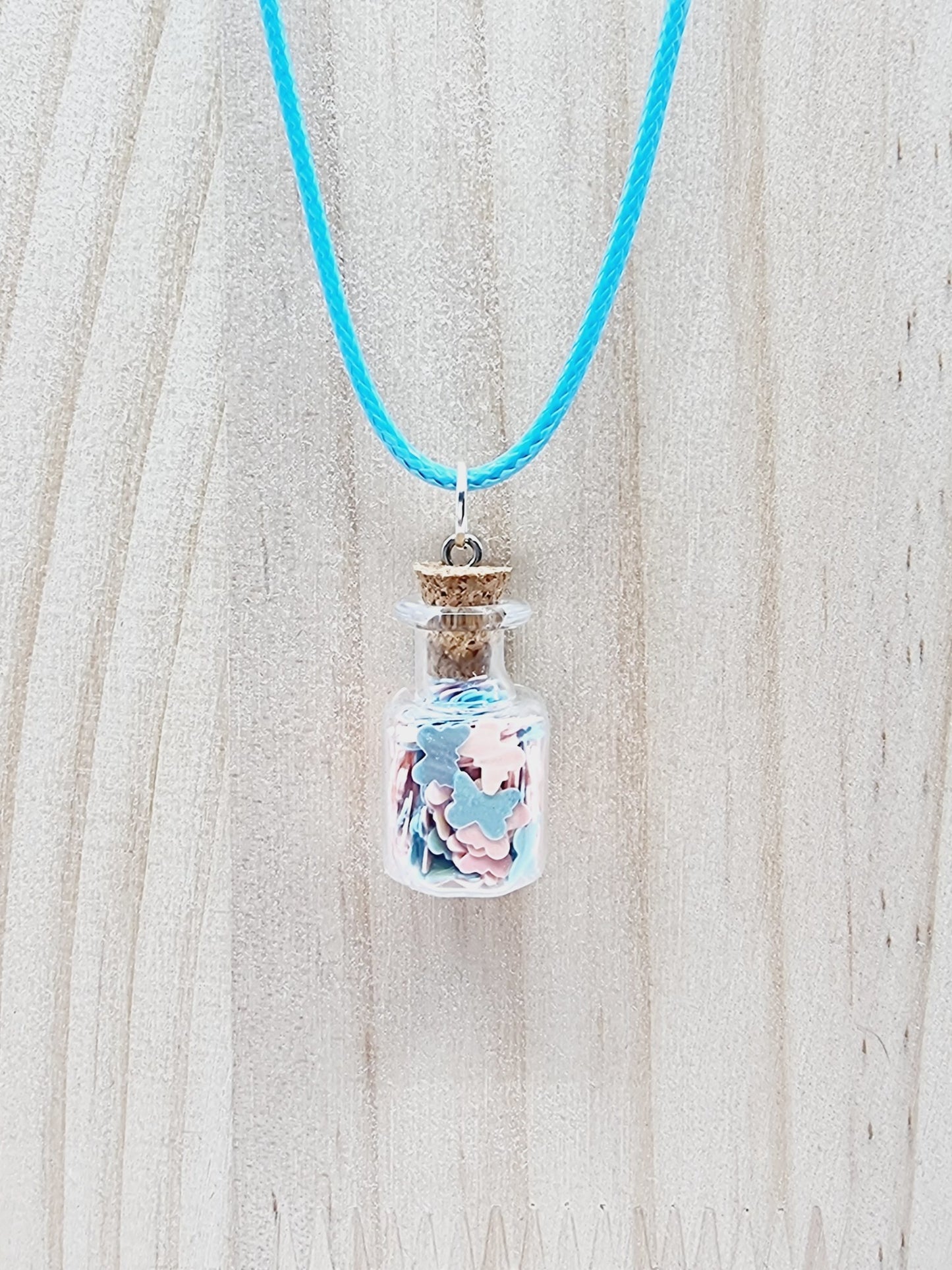 Collier fiole - étoiles roses/bleues pâles